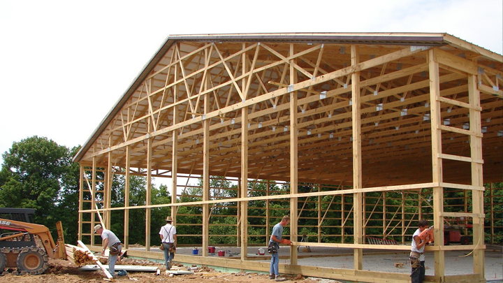 pole barn contractors working on a building