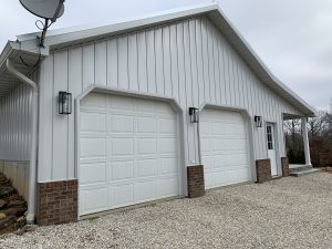 white board and batten siding on two car garage