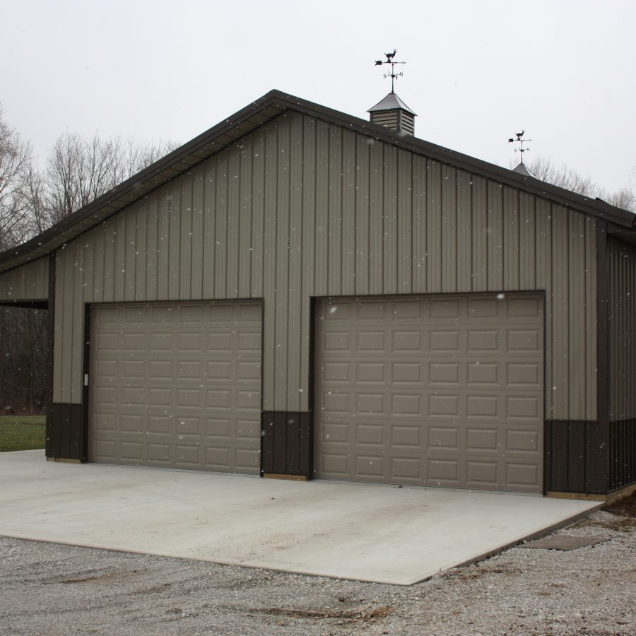 new post frame garage with overhead doors
